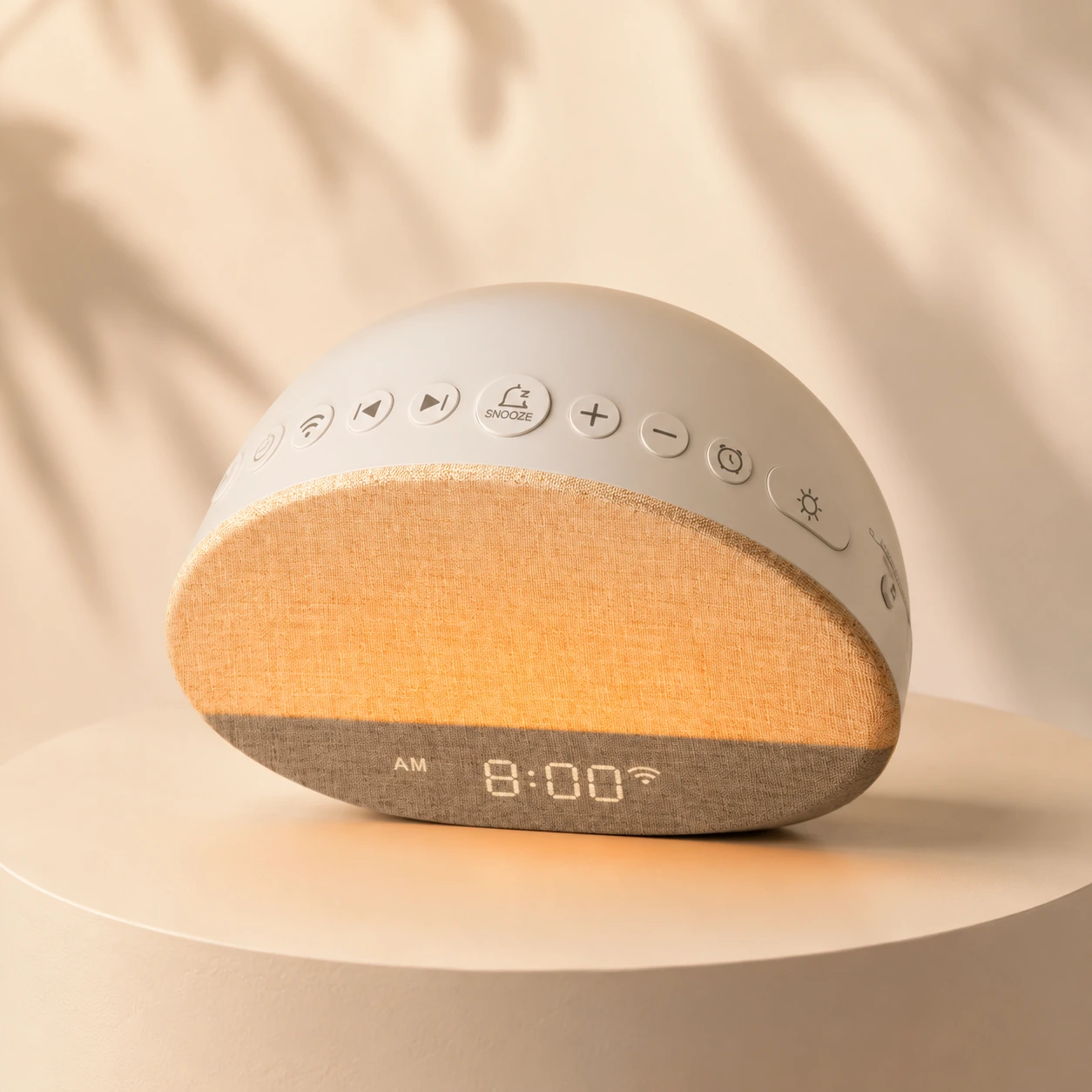 Angled studio view of the Dreamegg Sunrise 1 Wake Up Alarm Clock with warm fabric-textured light and side buttons.