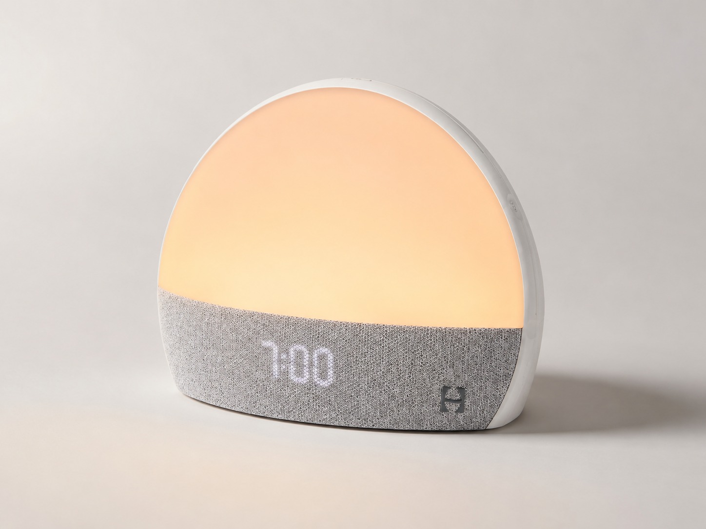 Hatch Restore Smart Alarm Clock studio product shot with soft warm light Hatch Restore Smart Alarm Clock studio product shot with soft warm light