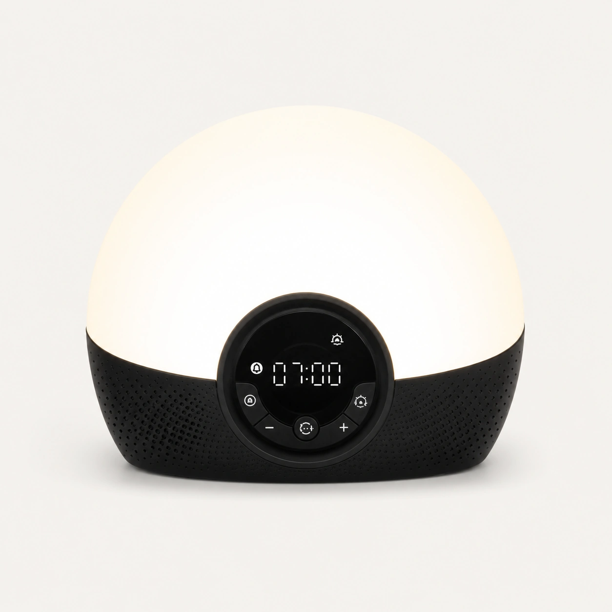 Lumie Bodyclock Rise150 Alarm Clock styled on a bedside table with books and decorative vases.