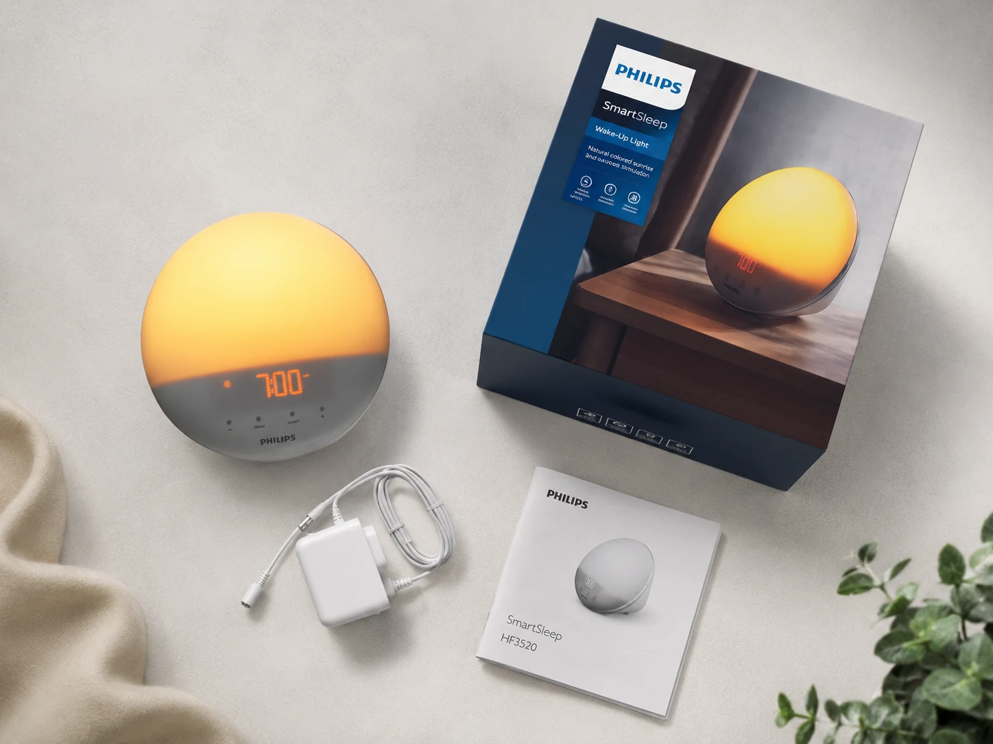 Philips SmartSleep HF3520/60 unboxing flat lay with box, adapter, and manual